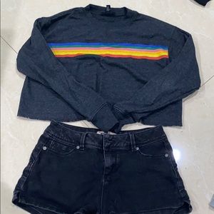 rainbow shirt and black shorts
